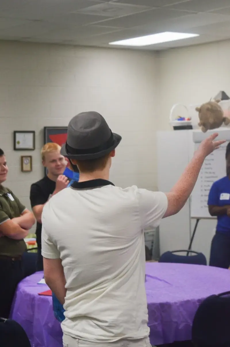 A student speaking to the group during a leadership exercise