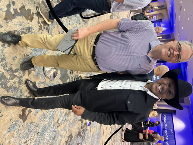 Don Walter connecting with a leader at a Maxwell Leadership event